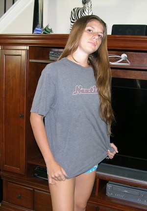 Amateur teen cutie JC takes off her panties and t-shirt to show her naked body