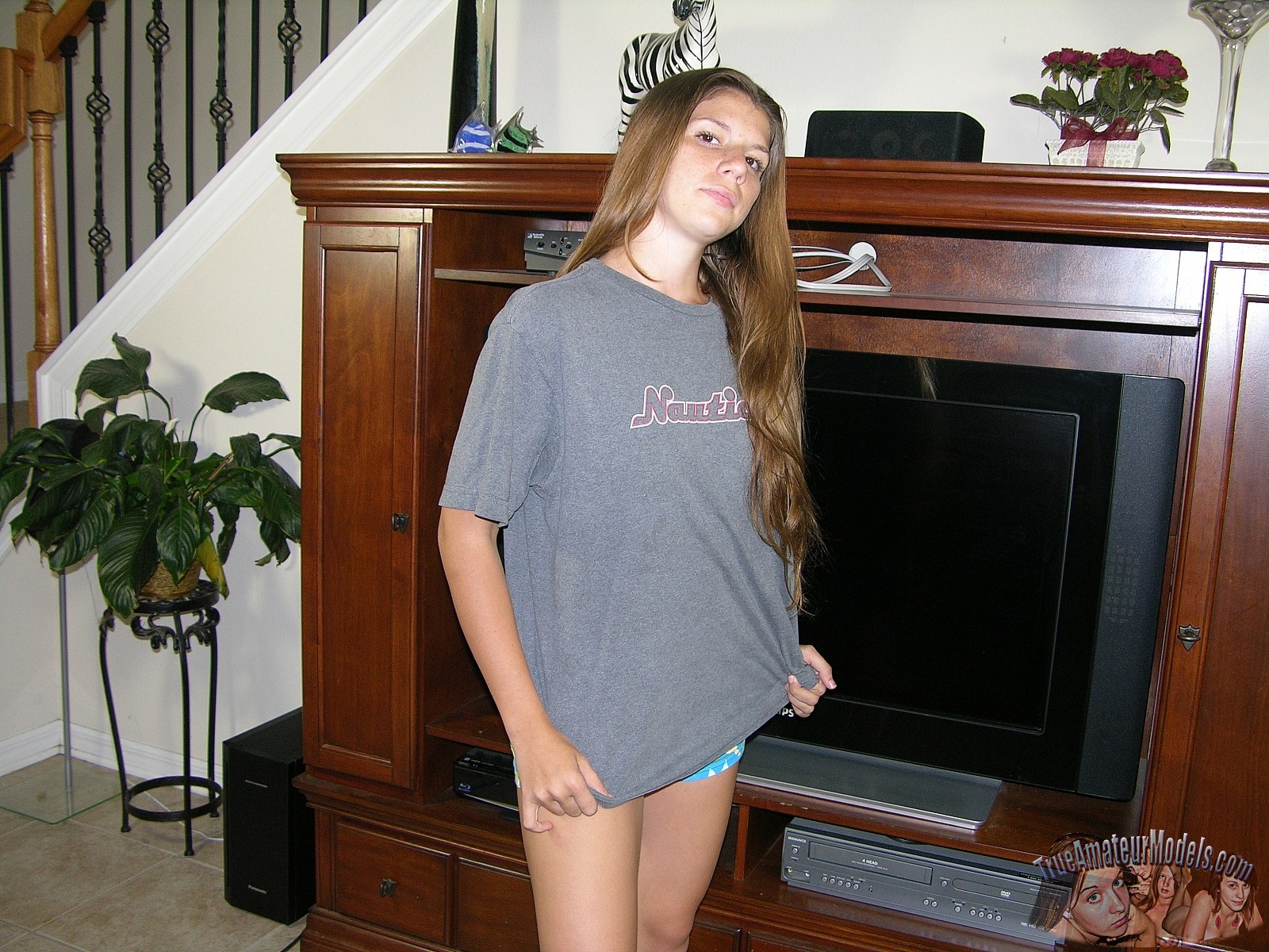 Amateur teen cutie JC takes off her panties and t-shirt to show her naked body image