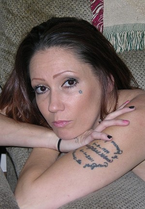 Amateur Tattooed Biker Chick Modeling Nude photo
