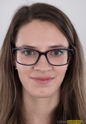 Nerdy but cute and very busty Veronika wearing glasses in her porn casting pics