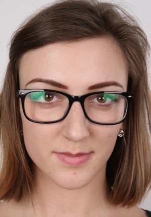 Cute little brunette teeny Vendula wearing glasses as she strips for her casting shots