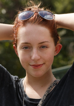 Busty amateur redhead Kelsey Berneray teasing by the lake
