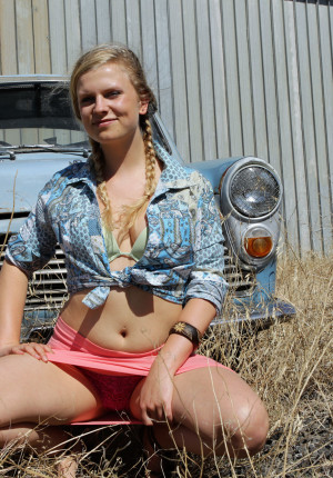Blonde Aussie babe Gretel having fun with her skirt up on a car outside
