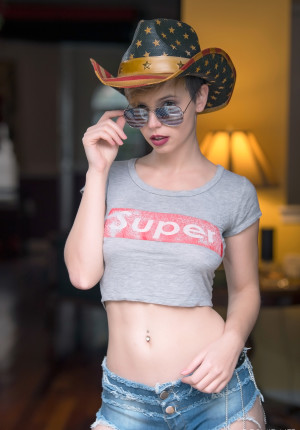 Petite little short haired pixie Elizabeth Hansen looks hot naked in her boots and coyboy hat