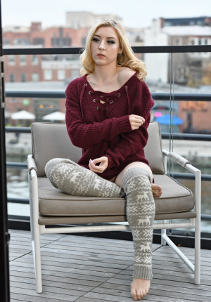 Serious looking blonde amateur Emma York in leg warmers on the roof