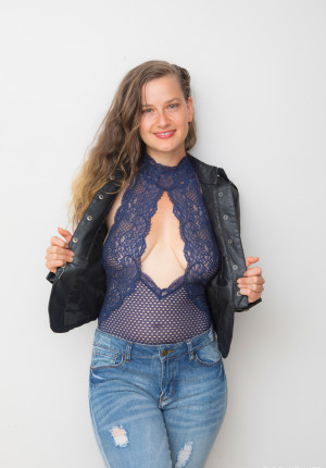 Shy novice poser Lillie Varga flashes her hairy pussy under her hot bodysuit