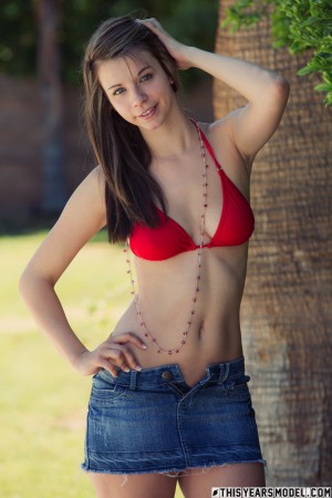 Adorable college babe Penny Kate drops her jean skirt and bikini to tease outside