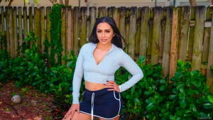 Curvy Latina amateur Lily Hall strips out of her shorts and panties to spread her ass