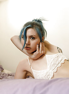 Blue haired cutie Nina Presley showing her ass in sheer panties