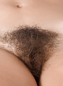 Sally undresses and gets her hairy pussy all wet so she can masturbate