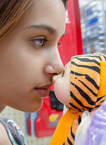 Uma Jolie playing in a toy store