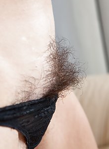 Hairy woman Eva's bush spreads outside her panties