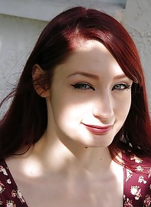 Adorable amateur redhead Violet lifts her skirt outside and shows us her beautiful pussy