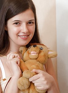 Lima strips and plays with her favorite stuffed toy